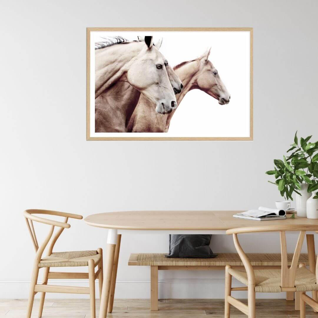 A brown and tan 3 Palomino Horses Artwork Wall Art Photo Print with a timber frame to hang next to your dining room table.