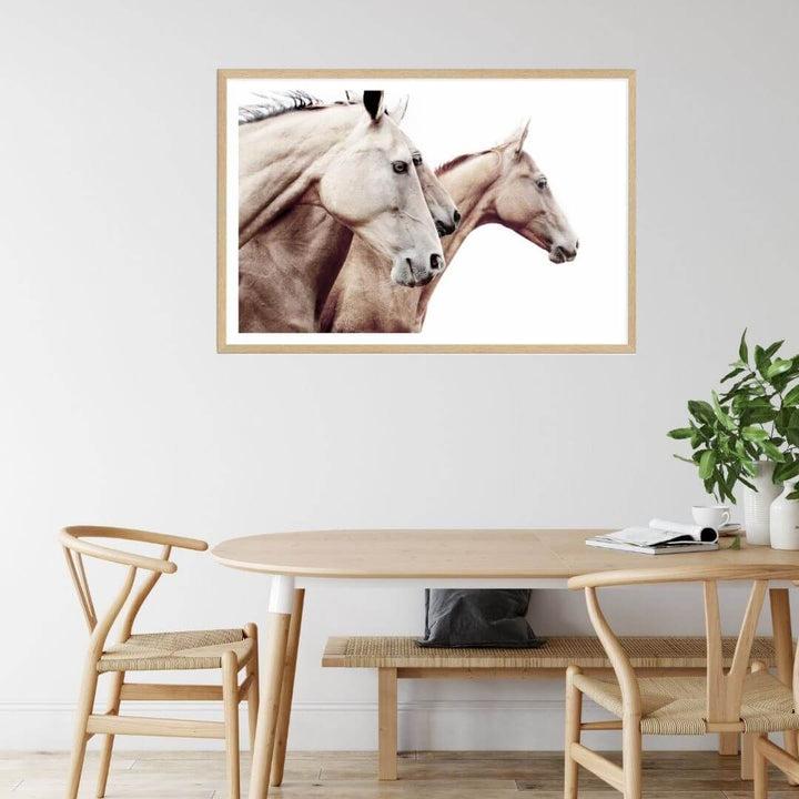 A brown and tan 3 Palomino Horses Artwork Wall Art Photo Print with a timber frame to hang next to your dining room table.