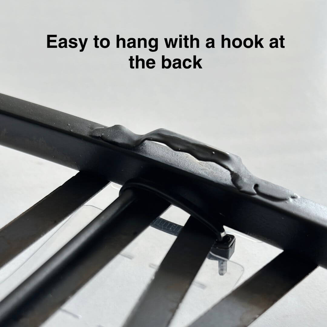 Back view showing easy-to-hang hook on black metal wall clock