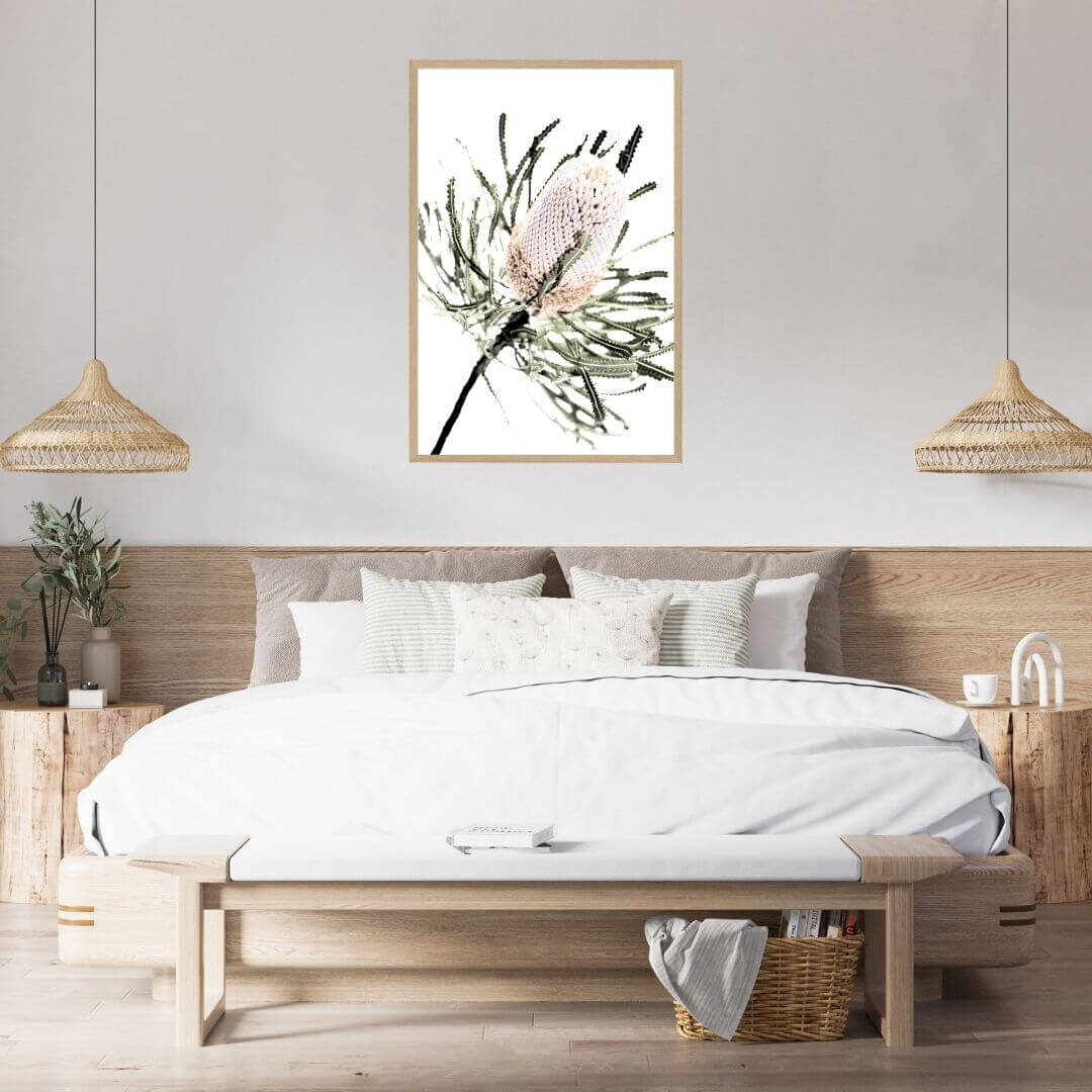 A wall art print of an Australian Native Banksia Flower A with a timber frame or unframed above a bed head wall in the bedroom