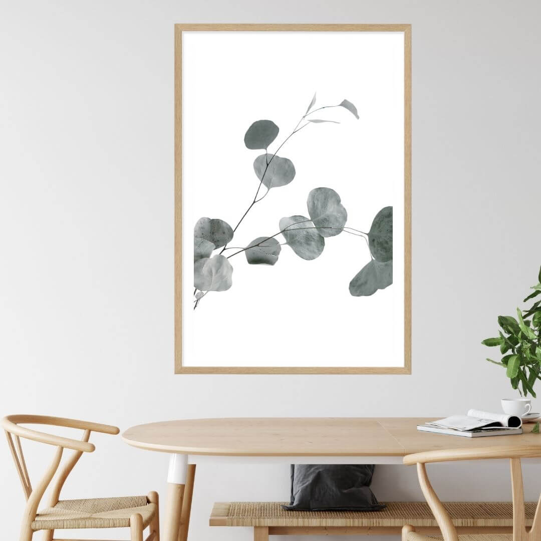 A wall art photo print of an Australian native eucalyptus leaves B with a timber frame to style a coastal Australian dining room