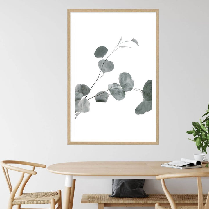 A wall art photo print of an Australian native eucalyptus leaves B with a timber frame to style a coastal Australian dining room