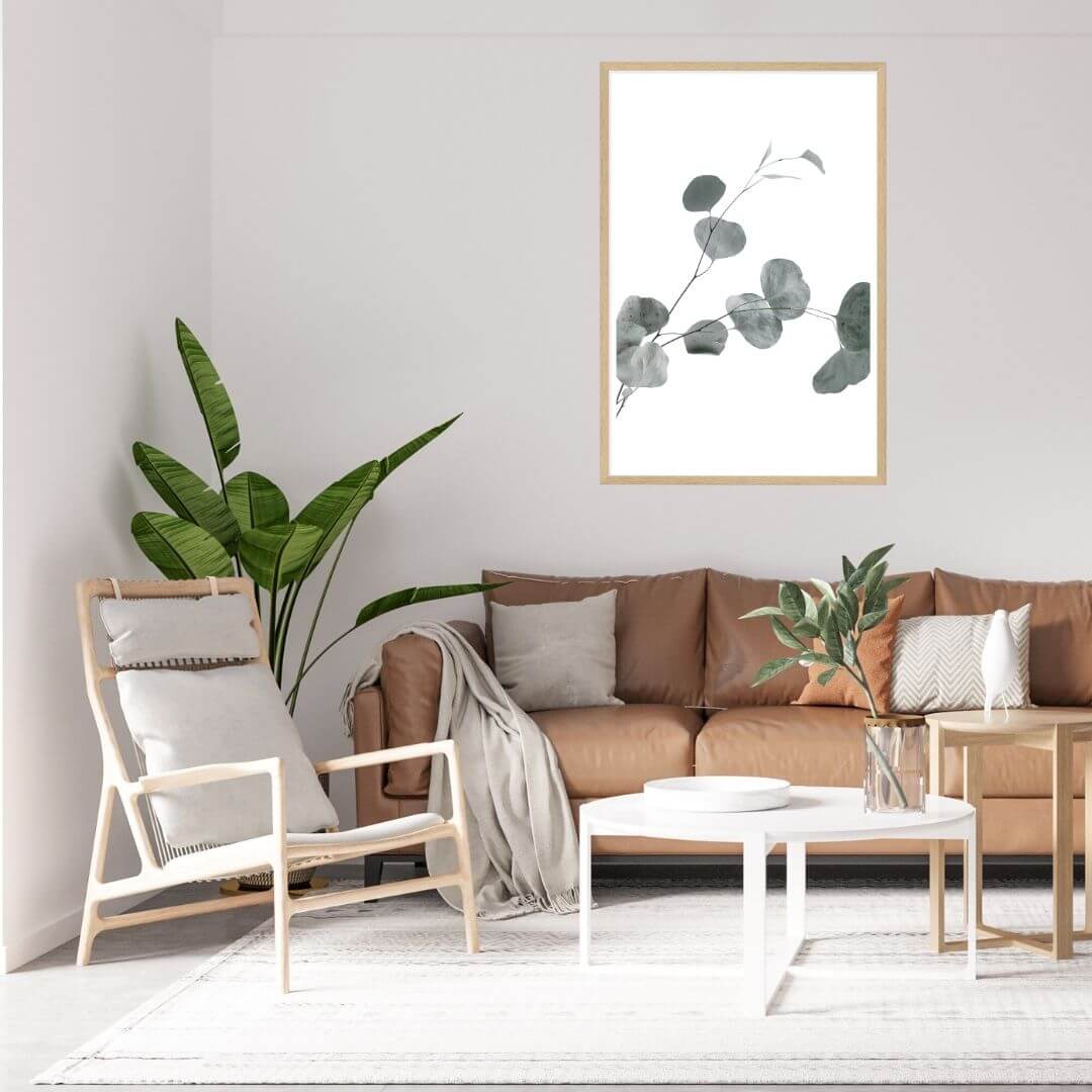 A wall art photo print of an Australian native eucalyptus leaves B with a black frame or unframed to decorate an empty wall