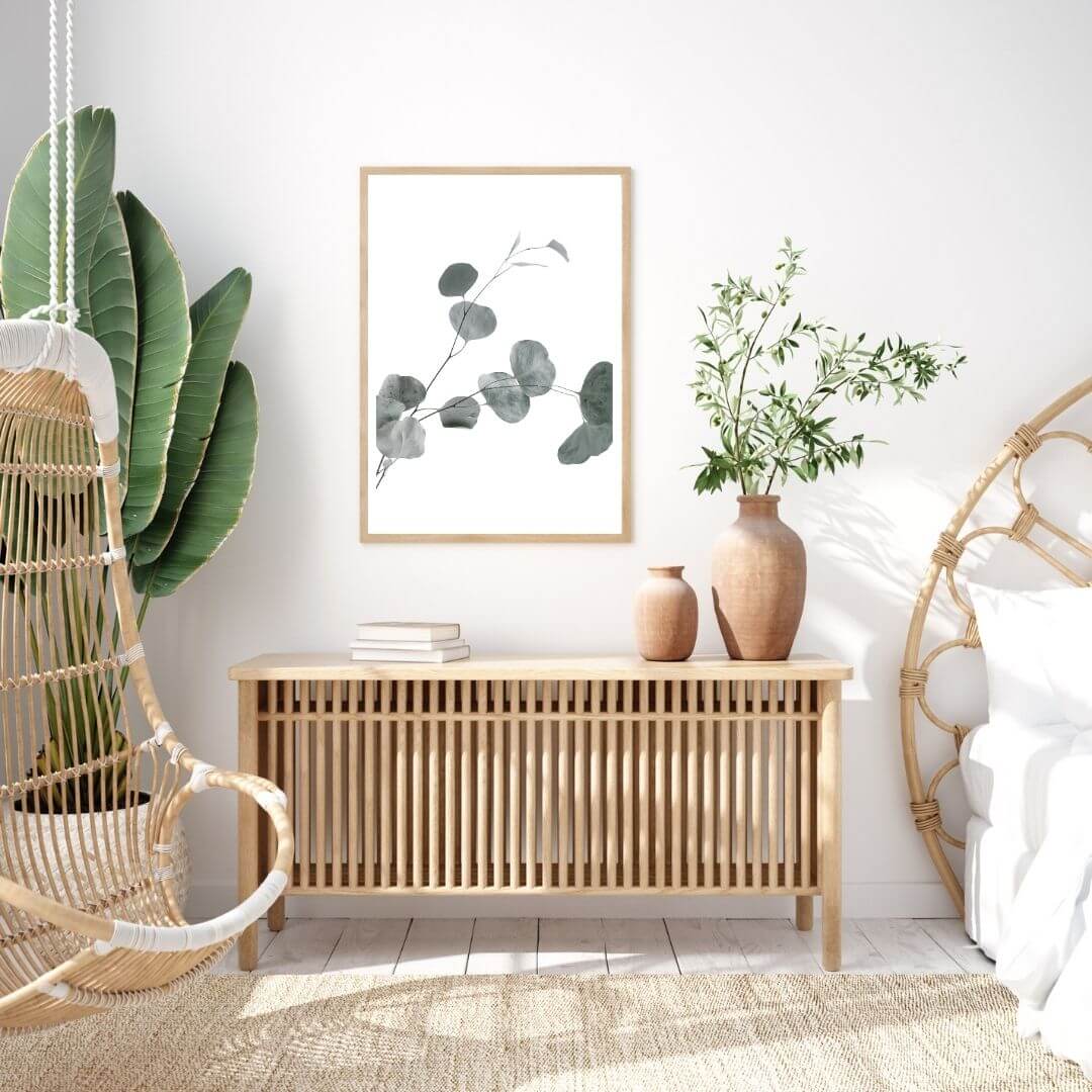 A botanical wall art photo print of an Australian native eucalyptus leaves B with a black frame for the wall in your bedroom