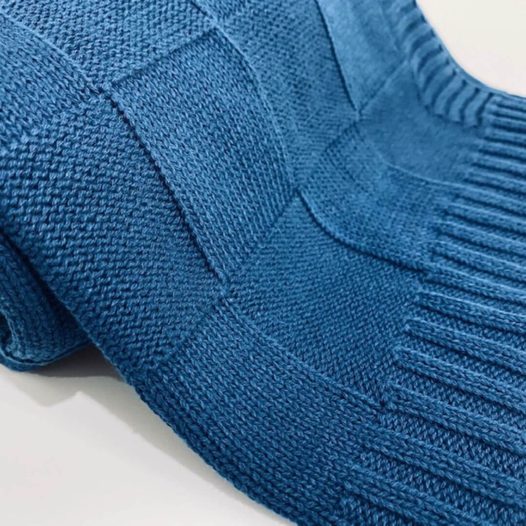 A super soft, light weight Knitted Baby Blanket by Anchor and Arrow perfect to wrap your baby and keep them comfy.