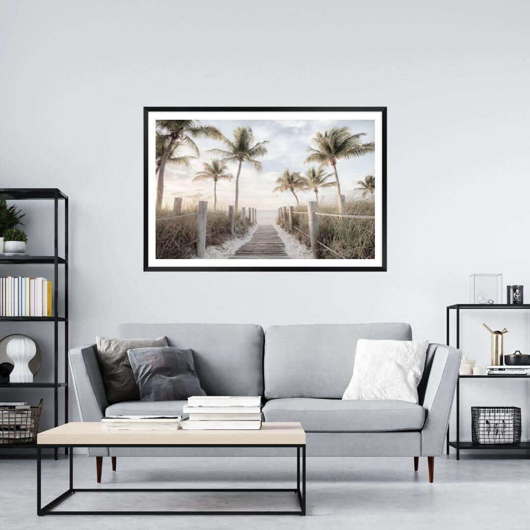 A coastal wall art photo print of a pathway to a beach on the keys Florida with palm trees with a black frame or unframed to decorate a wall in your living room