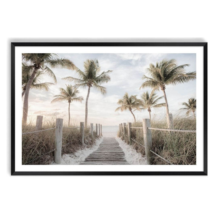 A coastal wall art photo print of a pathway to a beach on the keys Florida with palm trees with a black frame, white border by Beautiful Home Decor