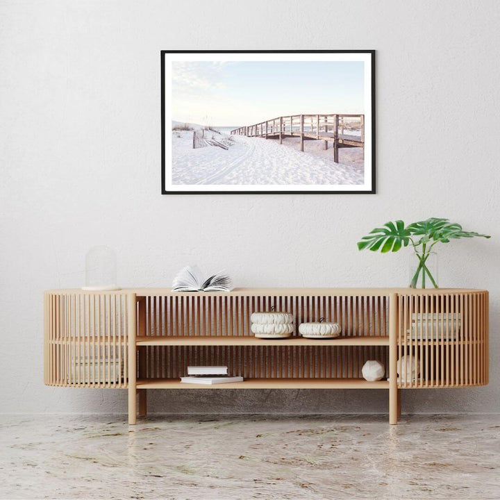 A wall art photo print of a beachside boardwalk with a black frame or unframed to decorate a wall above your console table