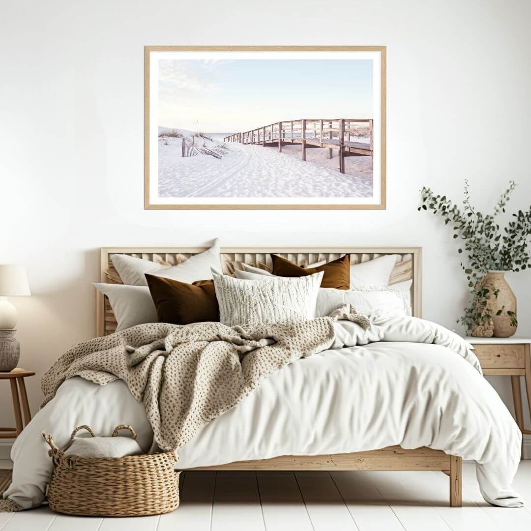 A coastal wall art photo print of a beachside boardwalk with a timber frame to decorate your bedroom walls