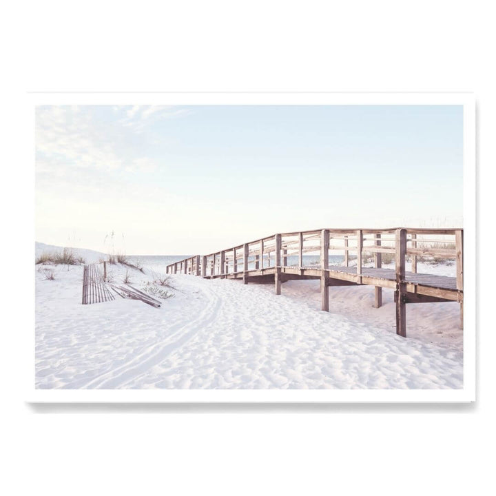 A coastal wall art photo print of a beachside boardwalk unframed with a white border by Beautiful Home Decor