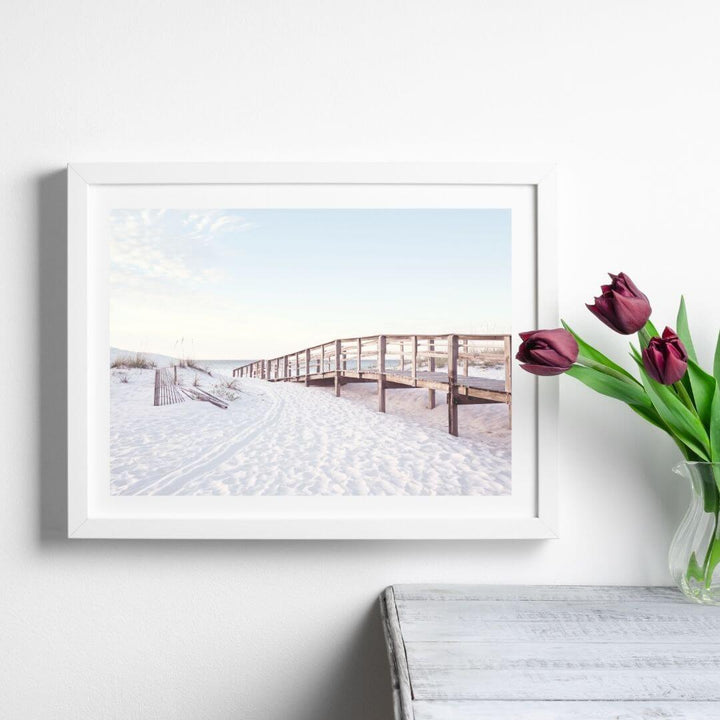 A coastal wall art photo print of a beachside boardwalk with a white frame or unframed to style shelves and empty walls