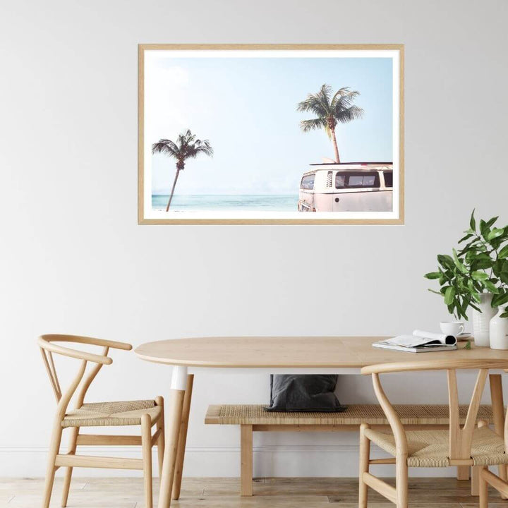 A coastal wall art photo print of a beige beachside kombi van with a timber frame to style a coastal Australian dining room