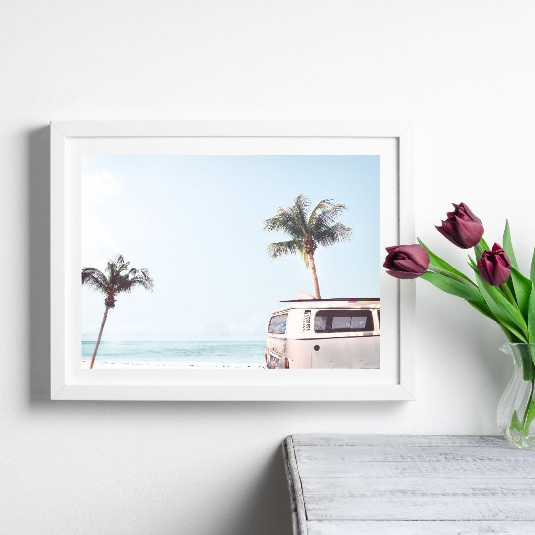 A coastal wall art photo print of a blue beachside kombi van with a white frame or unframed to style shelves and empty walls