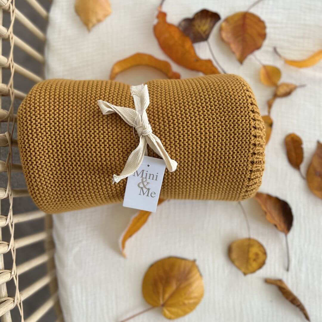 Perfect Baby shower gift ideas include a lusciously soft Cable Knitted Baby Blanket in beautiful Mustard Yellow to wrap your baby, made by Mini and Me.