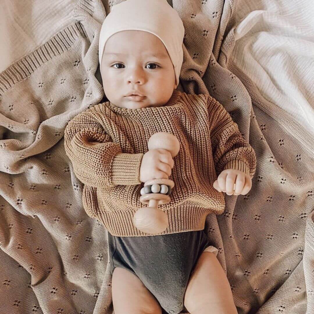 Heirloom knitted baby blanket in soft Enoki Brown – a beautiful Christmas gift idea to keep baby warm and cozy.