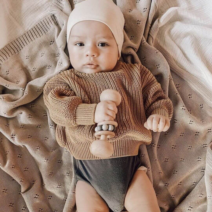 Heirloom knitted baby blanket in soft Enoki Brown – a beautiful Christmas gift idea to keep baby warm and cozy.