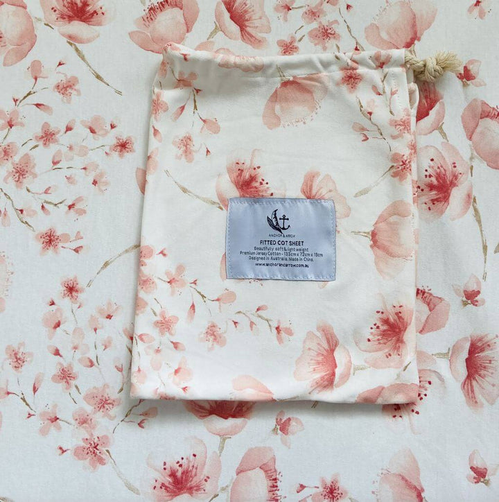 A lightweight Jersey Cotton Fitted Baby Cot Sheet in a beautiful Cherry Blossom design.