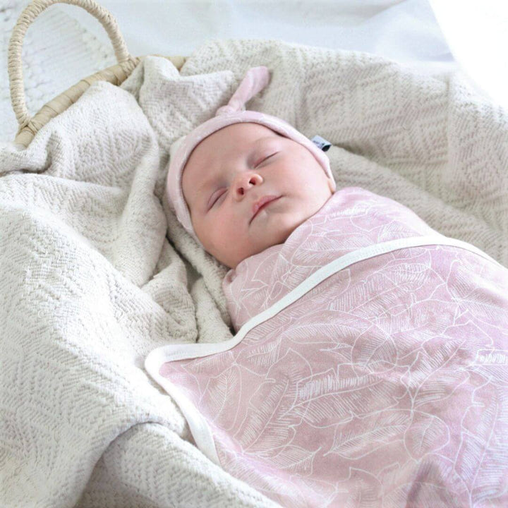 Anchor and Arrow baby swaddle wrap and beanie in Pink Palm – soft jersey cotton for everyday comfort.