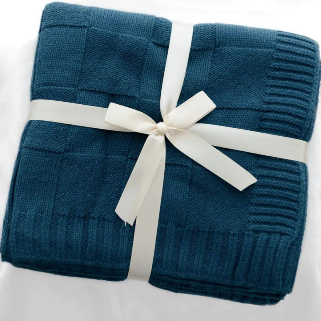 An Anchor and Arrow super soft, light weight Knitted Baby Blanket perfect to wrap your baby and keep them warm. 