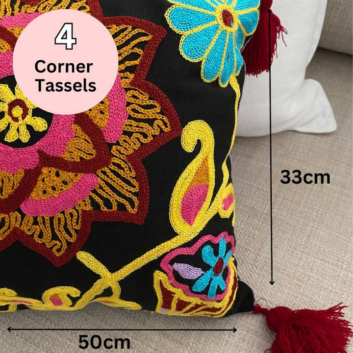 The Rectangle Lumbar Boho Embroidered Floral Cushion has 4 tassels on the corners