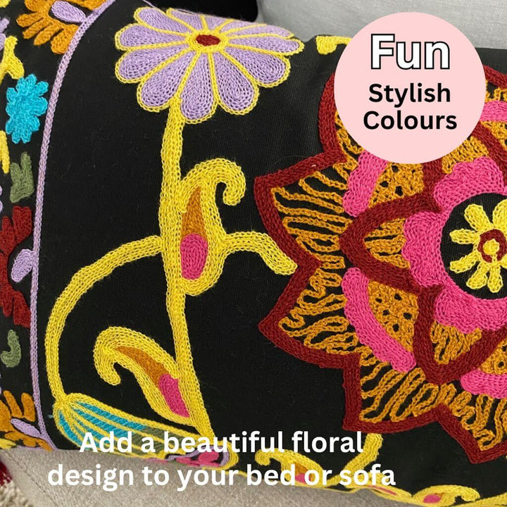 A black and colourful Boho Embroidered Floral Cushion to style your bed or sofa.