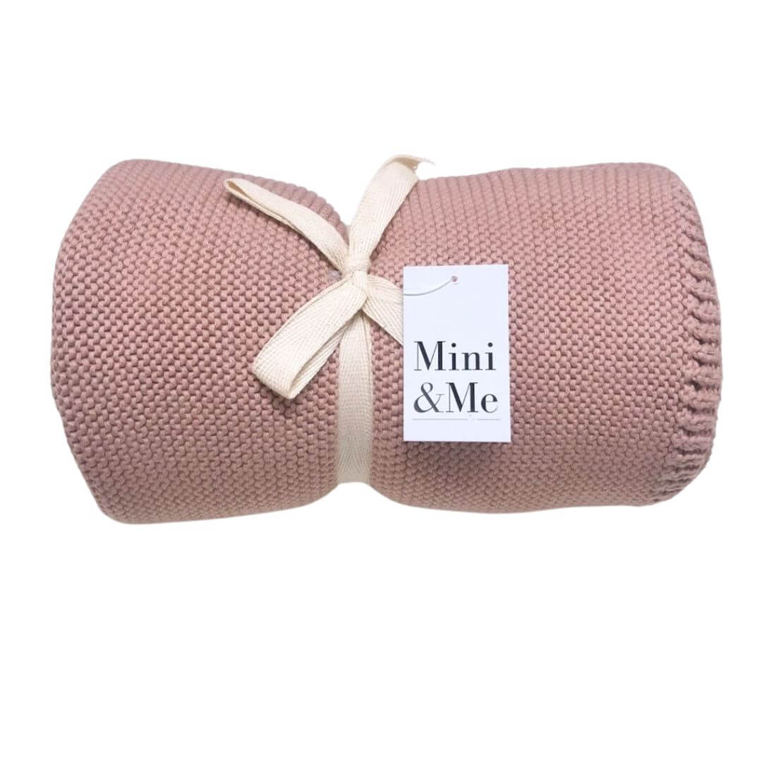 A lusciously soft Cable Knitted Baby Blanket in beautiful Blush Pink to wrap your baby. 