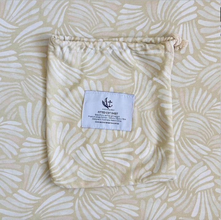 A breathable Jersey Cotton Fitted Baby Cot Sheet in a cute Sandy Shell design.