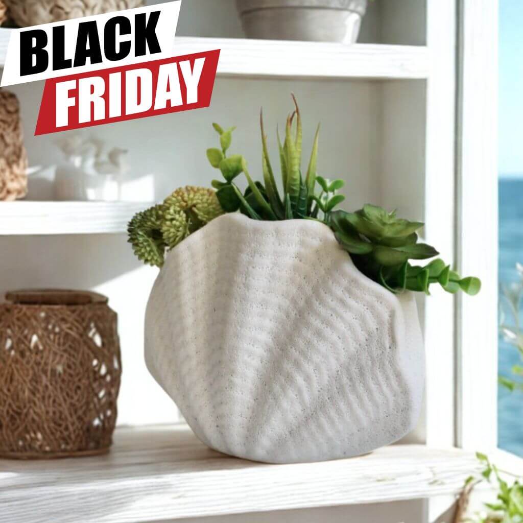 Decorative white vase with plants on a shelf with Black Friday Sale on home decor