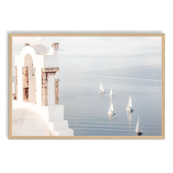 A coastal wall art photo print of Boats sailing on the sea in Santorini Greece  with a timber frame, no white border at Beautiful Home Decor
