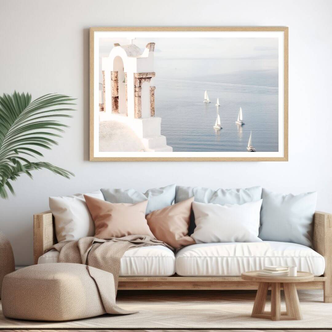 A coastal wall art photo print of Boats sailing on the sea in Santorini Greece  with a timber frame for the living room by Beautiful Home Decor