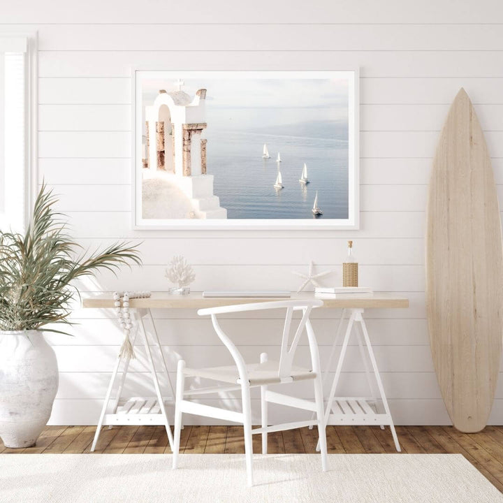 A coastal wall art photo print of Boats sailing on the sea in Santorini Greece  with a white frame or unframed to decorate a wall in your office dining room