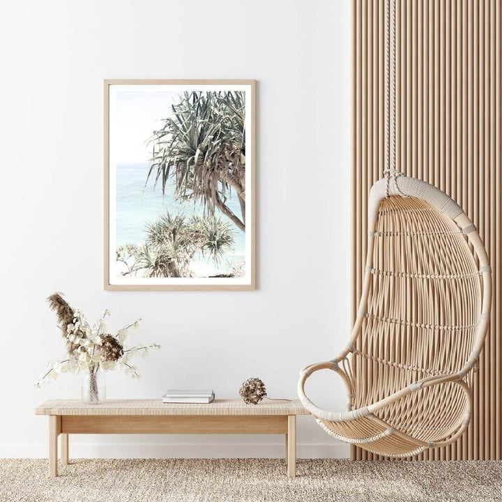 A coastal wall art photo print of the Byron Bay Beach Sea View with Pandanus Palms with a timber frame for the living room by Beautiful Home Decor