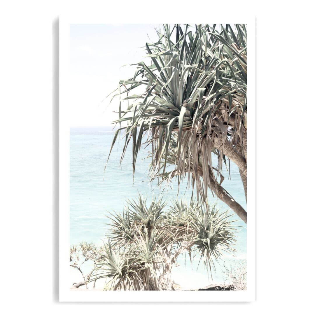 A coastal wall art photo print of the Byron Bay Beach Sea View with Pandanus Palms unframed with a white border by Beautiful Home Decor