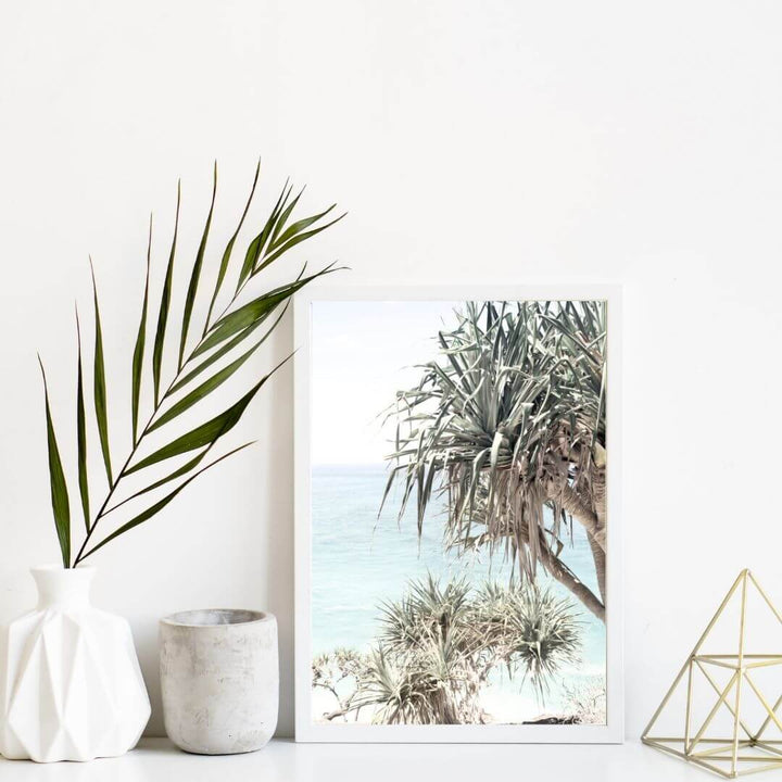 A coastal wall art photo print of the Byron Bay Beach Sea View with Pandanus Palms with a white frame or unframed to style shelves and empty walls