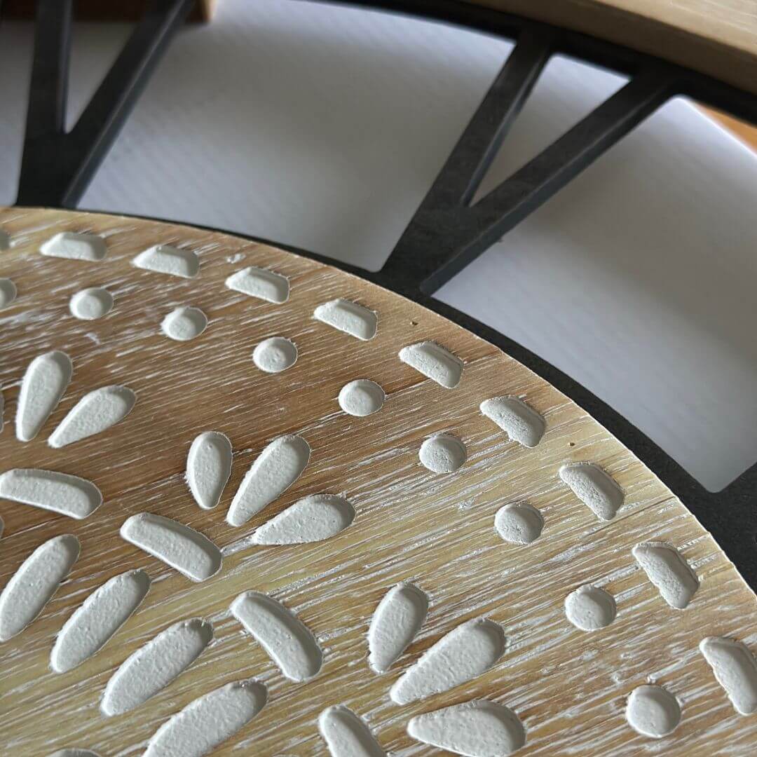 60cm Carved Industro Hamptons Wall Clock hand carved face with a white design.