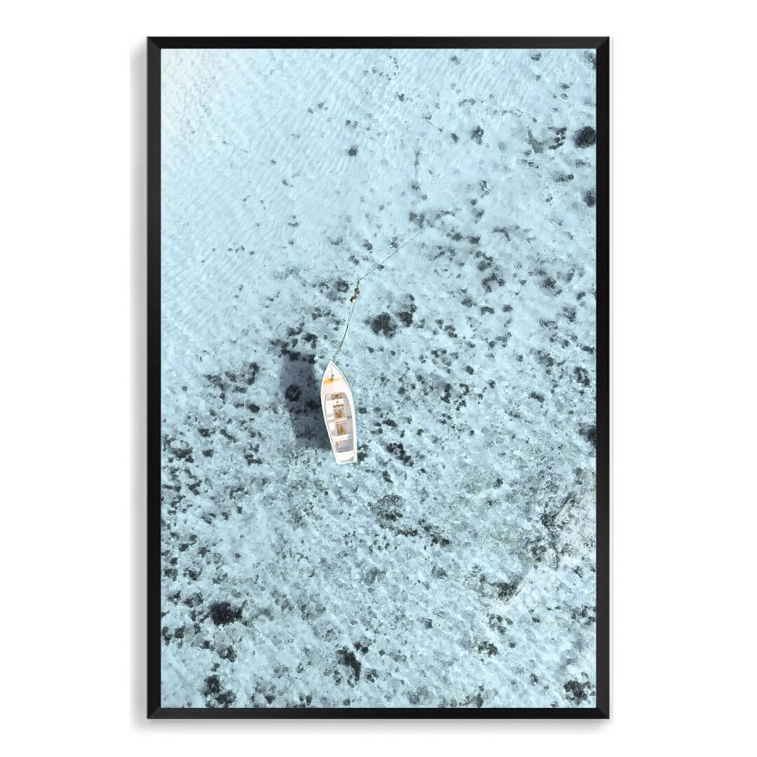 A wall art photo print of a white boat on a clear blue ocean off the Amalfi Coast Italy with a black frame, no white border at Beautiful Home Decor