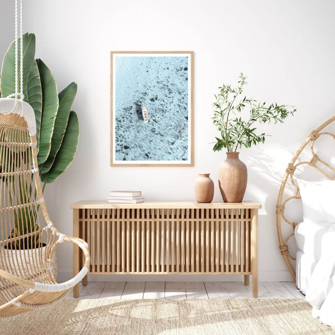 A coastal wall art photo print of a white boat on a clear blue ocean off the Amalfi Coast Italy with a timber frame to decorate your bedroom by Beautiful Home Decor