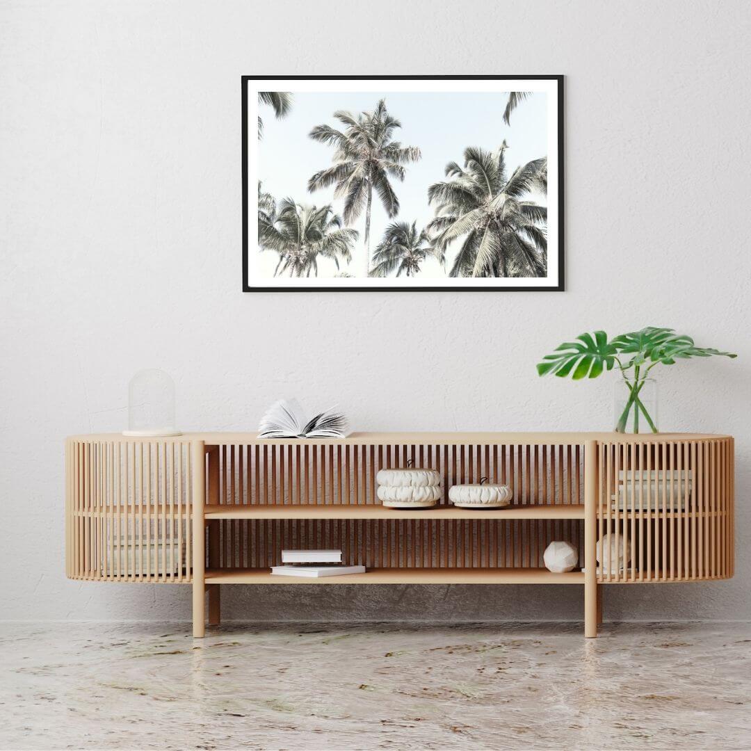 A wall art photo print of coastal palm trees and blue sky with a black frame in hallway shop online at Beautiful Home Decor with free shipping
