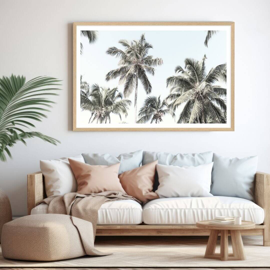 A wall art photo print of coastal palm trees and blue sky with a timber frame or unframed for your living room walls