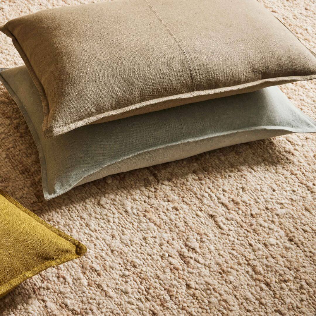 3 Como Rectangle linen cushions on a rug