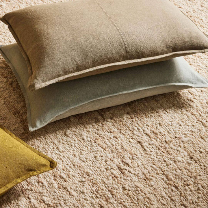 3 Como Rectangle linen cushions on a rug