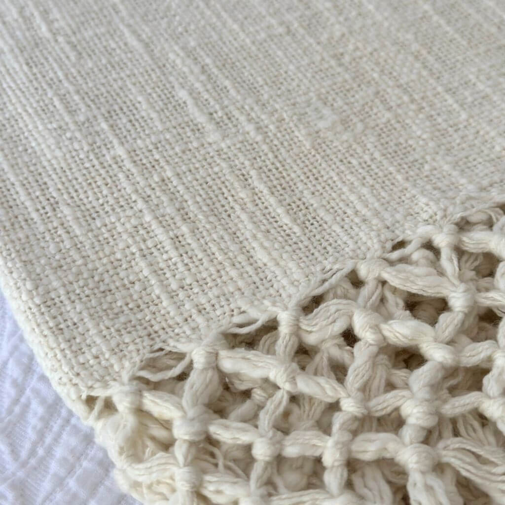 A gorgeous Dove Cotton Throw in Ivory White measures 130cm x 170cm, perfect to decorate your bed or sofa