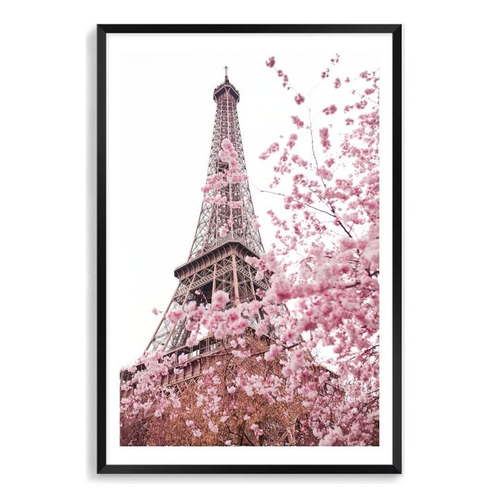 A wall art photo print of the Eiffel Tower in Spring with a black frame, white border on a bathroom wall