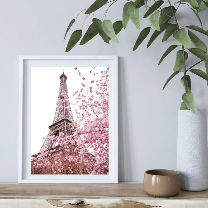 A wall art photo print of the Eiffel Tower in Spring with a white frame or unframed to decorate an empty wall