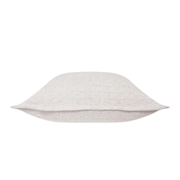 Side view of the Gemma Ivory Boucle Cushion, measuring 50cm is the perfect decorative cushion to style your bed or sofa.