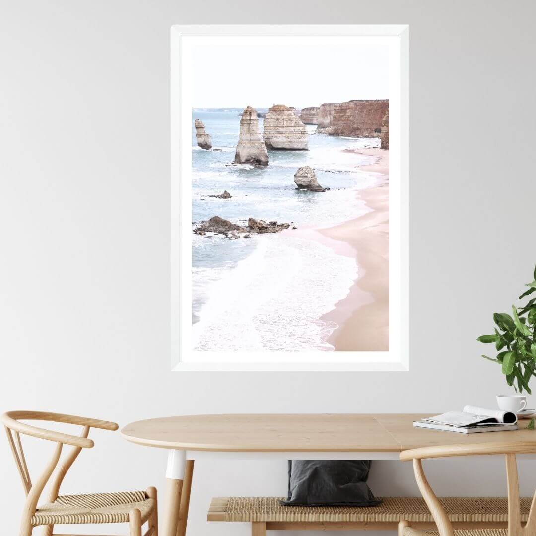 A coastal wall art photo print of the Great Ocean Road A Twelve Apostles with a white frame, white border on dining room wall
