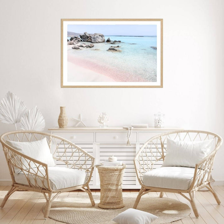A coastal wall art photo print of a pink beach in Greece with a timber frame for the living room by Beautiful Home Decor