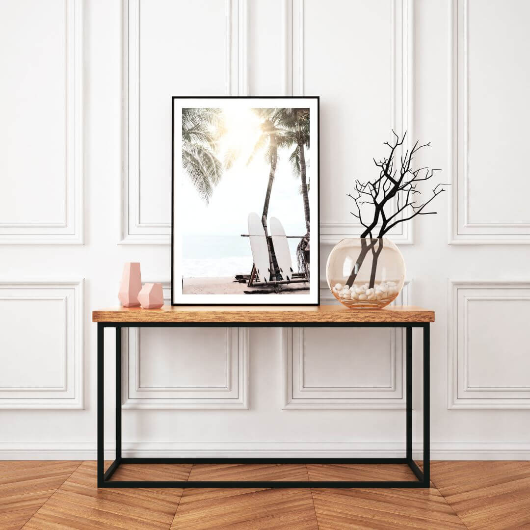 A wall art print in the hallway of two surf boards under the palm trees on a surfer beach in Hawaii for a hallway