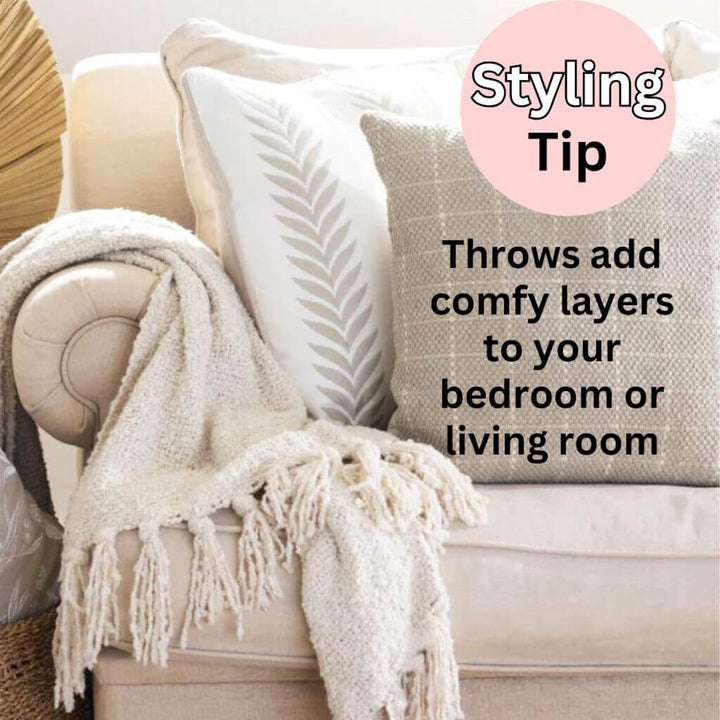 A cream Jade Throw with a boucle design, measuring 130cm x 160cm to decorate your bedroom or living room.