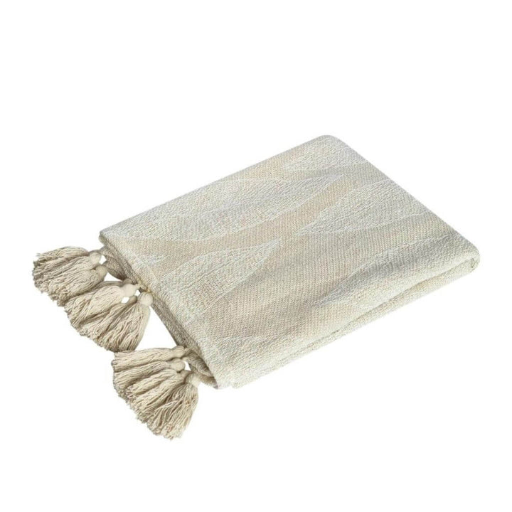 The Kye Cream & Ivory Cotton Throw with a leaf pattern on both sides, measures 130cmx 160cm to style your bed or sofa.